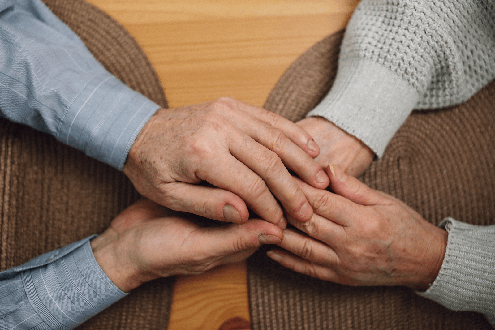 Two people holding hands